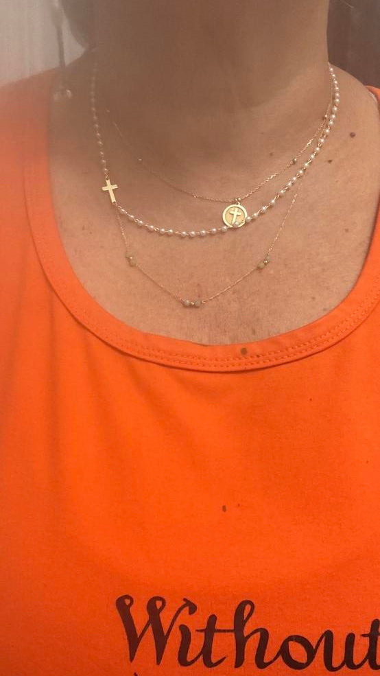 Customer wearing the Cross & Pearls Necklace