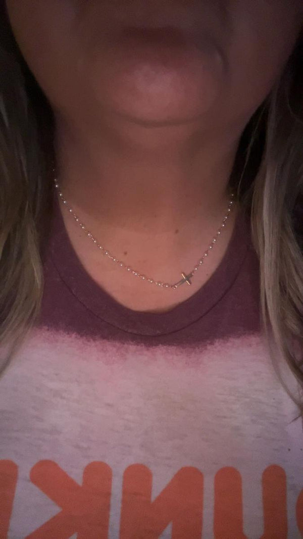 Customer wearing the Cross & Pearls Necklace